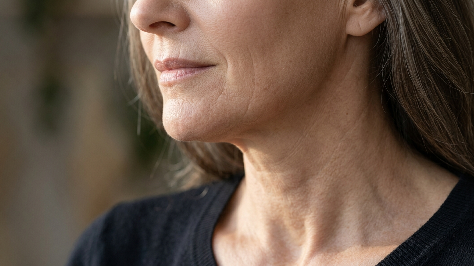A surgeon discussing the long-term benefits of a neck lift with facelift to achieve a rejuvenated facial appearance.